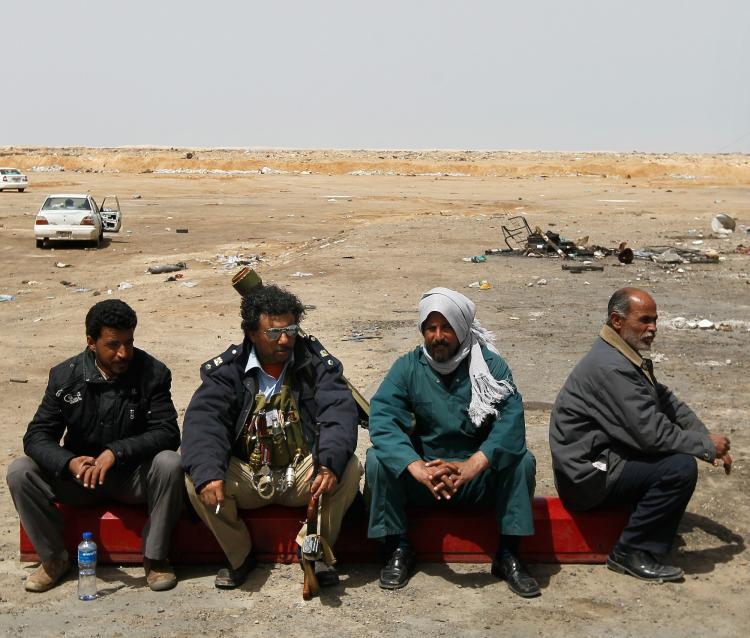 <a><img src="https://www.theepochtimes.com/assets/uploads/2015/09/111752855.jpg" alt="TOUGH SPOT: Libyan rebel soldiers sit at a checkpoint on a road leading to front-line positions April 6 near Brega, Libya. While the war against Libyan leader Moammar Gadhafi is still being waged, the task of nation-building, when it's over, may keep the U.S. and NATO in the country for even longer. (Chris Hondros/Getty Images)" title="TOUGH SPOT: Libyan rebel soldiers sit at a checkpoint on a road leading to front-line positions April 6 near Brega, Libya. While the war against Libyan leader Moammar Gadhafi is still being waged, the task of nation-building, when it's over, may keep the U.S. and NATO in the country for even longer. (Chris Hondros/Getty Images)" width="575" class="size-medium wp-image-1805520"/></a>