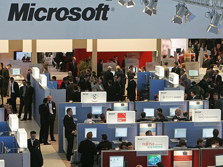 <a><img src="https://www.theepochtimes.com/assets/uploads/2015/09/111micro80128747.jpg" alt="Fair goers visit the booth of software company Microsoft on March 5, 2008 at the CeBIT trade fair in Hanover.   (Nigel Treblin/AFP/Getty Images)" title="Fair goers visit the booth of software company Microsoft on March 5, 2008 at the CeBIT trade fair in Hanover.   (Nigel Treblin/AFP/Getty Images)" width="320" class="size-medium wp-image-1834012"/></a>