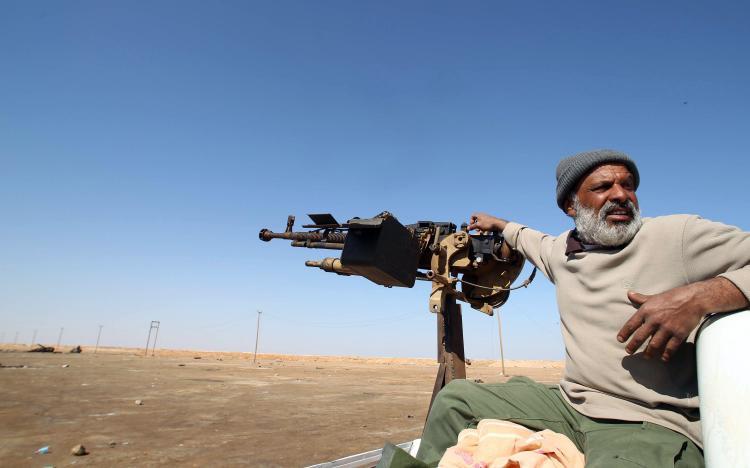 <a><img src="https://www.theepochtimes.com/assets/uploads/2015/09/112057552.jpg" alt="A Libyan rebel sits next to a heavy machine gun at the western gate of the eastern city of Ajdabiya, on April 12, 2011. (Marwan Naamani/AFP/Getty Images)" title="A Libyan rebel sits next to a heavy machine gun at the western gate of the eastern city of Ajdabiya, on April 12, 2011. (Marwan Naamani/AFP/Getty Images)" width="320" class="size-medium wp-image-1805629"/></a>