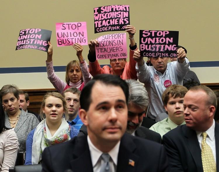 <a><img src="https://www.theepochtimes.com/assets/uploads/2015/09/112183312.jpg" alt="OPPOSITION: Members of Code Pink (L-R) Medea Benjamin, Liz Hourican, and Tighe Barry, protest as Wisconsin Gov. Scott Walker (C) attends the House Oversight and Government Reform Committee April 14 on Capitol Hill in Washington, D.C.  (Alex Wong/Getty Images)" title="OPPOSITION: Members of Code Pink (L-R) Medea Benjamin, Liz Hourican, and Tighe Barry, protest as Wisconsin Gov. Scott Walker (C) attends the House Oversight and Government Reform Committee April 14 on Capitol Hill in Washington, D.C.  (Alex Wong/Getty Images)" width="320" class="size-medium wp-image-1801219"/></a>