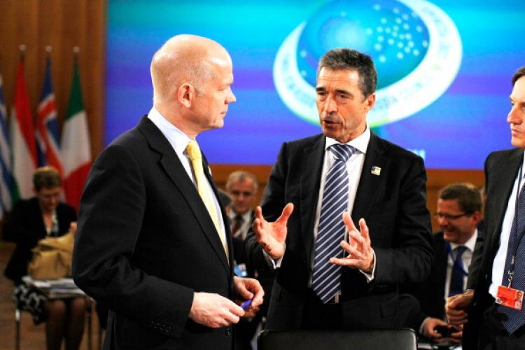<a><img src="https://www.theepochtimes.com/assets/uploads/2015/09/112222687.jpg" alt="NATO Secretary General Anders Fogh Rasmussen (R) talks with U.K. Foreign Secretary William Hague (L) at an informal meeting of NATO member foreign ministers on April 15, 2011 in Berlin, Germany.  (Carsten Koall/Getty Images)" title="NATO Secretary General Anders Fogh Rasmussen (R) talks with U.K. Foreign Secretary William Hague (L) at an informal meeting of NATO member foreign ministers on April 15, 2011 in Berlin, Germany.  (Carsten Koall/Getty Images)" width="320" class="size-medium wp-image-1804819"/></a>