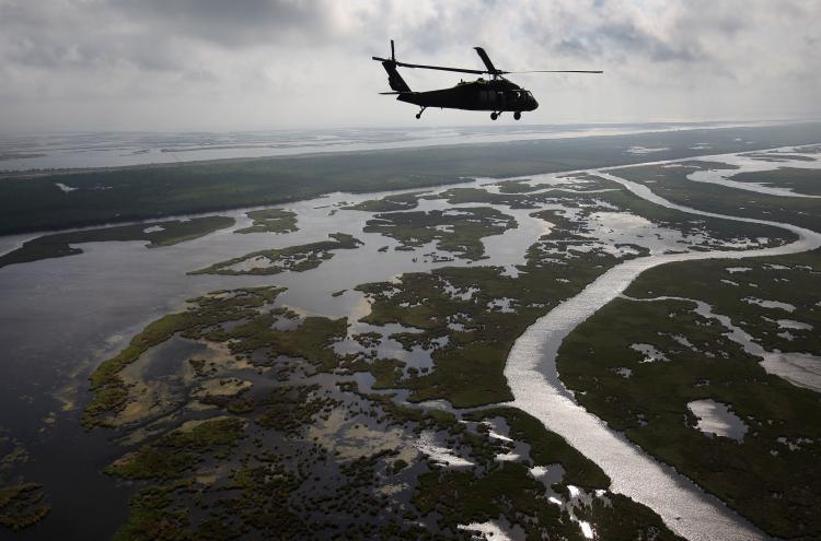 <a><img src="https://www.theepochtimes.com/assets/uploads/2015/09/112582890-oil.jpg" alt="A Louisiana National Guard blackhawk flies over marshland on April 19. A year after the BP oil spill, BP claims that most of the oil has been removed. Louisiana Wildlife and Fisheries says, however, that much of the cleaning has been superficial, as the oil has seeped into the soil, killing marshes and further eroding the state's damaged delta ecosystem. (John Moore/Getty Images)" title="A Louisiana National Guard blackhawk flies over marshland on April 19. A year after the BP oil spill, BP claims that most of the oil has been removed. Louisiana Wildlife and Fisheries says, however, that much of the cleaning has been superficial, as the oil has seeped into the soil, killing marshes and further eroding the state's damaged delta ecosystem. (John Moore/Getty Images)" width="320" class="size-medium wp-image-1805017"/></a>
