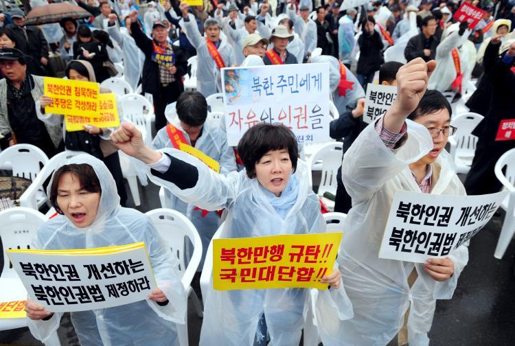 <a><img src="https://www.theepochtimes.com/assets/uploads/2015/09/113174166.jpg" alt="South Korean protestors shout slogans during a rally against North Korea's regime in Seoul on April 26. The placards read 'Freedom and human rights for North Korean people.' (Ji-Hwan/AFP/Getty Images)" title="South Korean protestors shout slogans during a rally against North Korea's regime in Seoul on April 26. The placards read 'Freedom and human rights for North Korean people.' (Ji-Hwan/AFP/Getty Images)" width="320" class="size-medium wp-image-1804075"/></a>