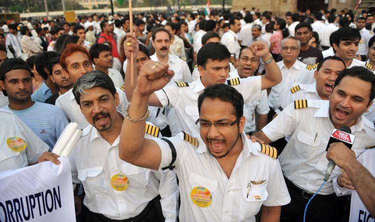 <a><img src="https://www.theepochtimes.com/assets/uploads/2015/09/113303154-indiaair.jpg" alt="Striking pilots representing the Indian Commercial Pilots Association (ICPA) shout anti-corruption slogans during a protest to support social activist Anna Hazare in Mumbai on May 1. Flagship carrier Air India's woes deepened as a pilots' strike continued into its fifth day on May 1. (Sajjad Hussain/Getty Images)" title="Striking pilots representing the Indian Commercial Pilots Association (ICPA) shout anti-corruption slogans during a protest to support social activist Anna Hazare in Mumbai on May 1. Flagship carrier Air India's woes deepened as a pilots' strike continued into its fifth day on May 1. (Sajjad Hussain/Getty Images)" width="320" class="size-medium wp-image-1804622"/></a>