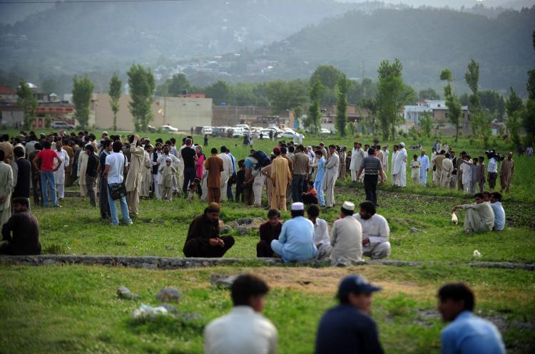 <a><img src="https://www.theepochtimes.com/assets/uploads/2015/09/113734859.jpg" alt="Pakistani people and media personnel gather in front of the final hiding place of Al-Qaeda chief Osama bin Laden in Abbottabad on May 5. Pakistan faces the prospect of Osama bin Laden's final hiding place becoming a shrine or macabre tourist spot unless the military destroys a compound attracting hundreds of visitors a day. (Asif Hassan/Getty Images)" title="Pakistani people and media personnel gather in front of the final hiding place of Al-Qaeda chief Osama bin Laden in Abbottabad on May 5. Pakistan faces the prospect of Osama bin Laden's final hiding place becoming a shrine or macabre tourist spot unless the military destroys a compound attracting hundreds of visitors a day. (Asif Hassan/Getty Images)" width="320" class="size-medium wp-image-1804392"/></a>