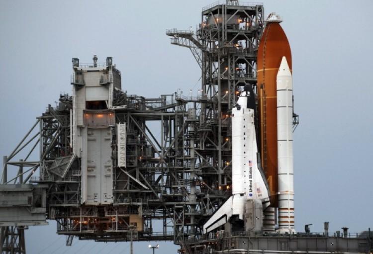 <a><img src="https://www.theepochtimes.com/assets/uploads/2015/09/118446059.jpg" alt="The US space shuttle Atlantis sits on Launch Pad 39A July 7, 2011 at Kennedy Space Center in Florida.  (Don Emmert/AFP/Getty Images)" title="The US space shuttle Atlantis sits on Launch Pad 39A July 7, 2011 at Kennedy Space Center in Florida.  (Don Emmert/AFP/Getty Images)" width="575" class="size-medium wp-image-1801184"/></a>