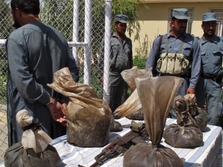 <a><img src="https://www.theepochtimes.com/assets/uploads/2015/09/119312737.jpg" alt="Afghan policemen (R) stand guard after an individual was found with bags containing opium and a Kalashnikov assault rifle, in Lashkar Gah, Helmand Province.  (Abdul Malik/AFP/Getty Images)" title="Afghan policemen (R) stand guard after an individual was found with bags containing opium and a Kalashnikov assault rifle, in Lashkar Gah, Helmand Province.  (Abdul Malik/AFP/Getty Images)" width="320" class="size-medium wp-image-1800629"/></a>