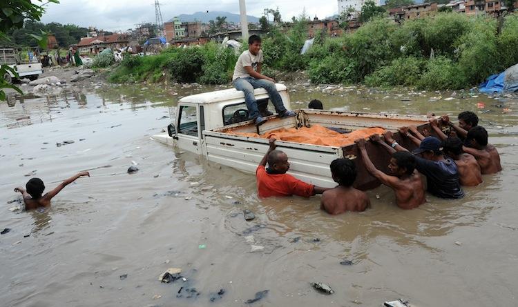 <a><img class="size-large wp-image-1787798" title="Monsoon rains in Nepal caused widespread flooding last July, 2011. A submerged jeep is pushed out of flood water near Bagmati River in Kathmandu on July 20, 2011.(Prakash Mathema/AFP/Getty Images)" src="https://www.theepochtimes.com/assets/uploads/2015/09/119823329.jpg" alt="" width="590" height="350"/></a>