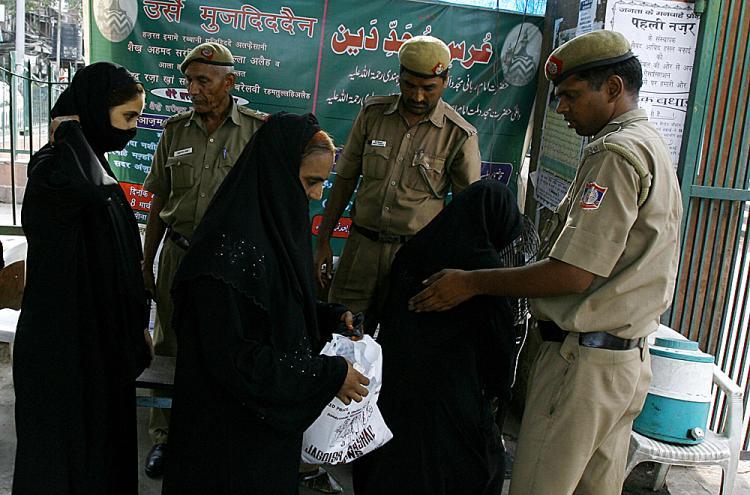 <a><img src="https://www.theepochtimes.com/assets/uploads/2015/09/11nbombla.jpg" alt="Indian police check the bags of Indian Muslim women visiting the Jama Masjid mosque (Background) in New Delhi on July 27, 2008, after security was put on high alert across the country following the bomb blasts in Ahmedabad.  (Manpreet Romana/AFP/Getty Images)" title="Indian police check the bags of Indian Muslim women visiting the Jama Masjid mosque (Background) in New Delhi on July 27, 2008, after security was put on high alert across the country following the bomb blasts in Ahmedabad.  (Manpreet Romana/AFP/Getty Images)" width="320" class="size-medium wp-image-1834740"/></a>