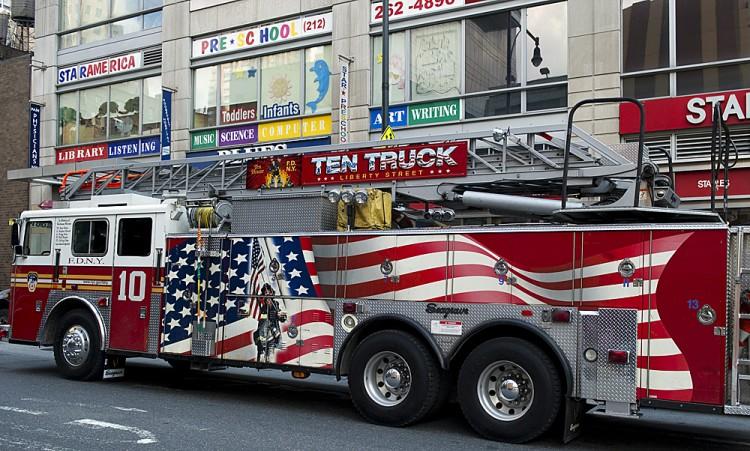<a><img class="size-large wp-image-1788952" title="A NYFD city firetruck outside a Times Square fire station" src="https://www.theepochtimes.com/assets/uploads/2015/09/120554985.jpg" alt="" width="590" height="355"/></a>