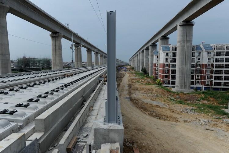 <a><img class="size-medium wp-image-1795326" src="https://www.theepochtimes.com/assets/uploads/2015/09/120810203.jpg" alt="China has suspended all new railway construction projects, as controversy swirls over the nation's high-speed network nearly three weeks after a fatal crash sparked safety concerns.  (STR/AFP/Getty Images)" width="200"/></a>