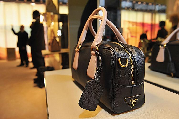 <a><img src="https://www.theepochtimes.com/assets/uploads/2015/09/124227968.jpg" alt="A Prada handbag is pictured here at the Prada Fifth Avenue store in New York City, Sept. 8. The company announced yesterday that its half-year profit jumped by 74 percent. (Slaven Vlasic/Getty Images for Prada)" title="A Prada handbag is pictured here at the Prada Fifth Avenue store in New York City, Sept. 8. The company announced yesterday that its half-year profit jumped by 74 percent. (Slaven Vlasic/Getty Images for Prada)" width="575" class="size-medium wp-image-1797535"/></a>
