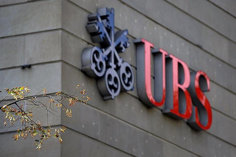 <a><img src="https://www.theepochtimes.com/assets/uploads/2015/09/125019530.jpg" alt="A logo of the Swiss banking giant UBS is seen at its main headquarters on September 15, 2011 in the center of Zurich. UBS revealed that a rogue trader had lost an estimated $2.0 billion (1.46 billion euros) in unauthorised trades, and that it may plunge into the red as a result. (FABRICE COFFRINI/AFP/Getty Images)" title="A logo of the Swiss banking giant UBS is seen at its main headquarters on September 15, 2011 in the center of Zurich. UBS revealed that a rogue trader had lost an estimated $2.0 billion (1.46 billion euros) in unauthorised trades, and that it may plunge into the red as a result. (FABRICE COFFRINI/AFP/Getty Images)" width="575" class="size-medium wp-image-1797676"/></a>
