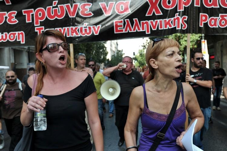 <a><img class="size-large wp-image-1774947" src="https://www.theepochtimes.com/assets/uploads/2015/09/154269156-Large.jpg" alt="Journalists  shout as they march in central Athens during a 24-hour strike." width="590" height="392"/></a>