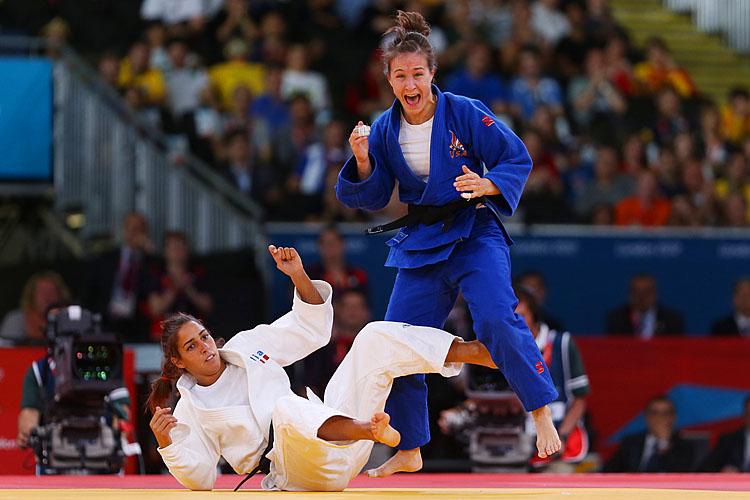 <a><img class="size-full wp-image-1784113" title="Olympics Day 3 - Judo" src="https://www.theepochtimes.com/assets/uploads/2015/09/1WEBMalloy1495368971.jpg" alt="Marti Malloy of the United States celebrates winning the bronze medal A against Giulia Quintavalle of Italy in the Women's -57 kg Judo on Day 3 of the London 2012 Olympic Games. (Julian Finney/Getty Images)" width="750" height="500"/></a>