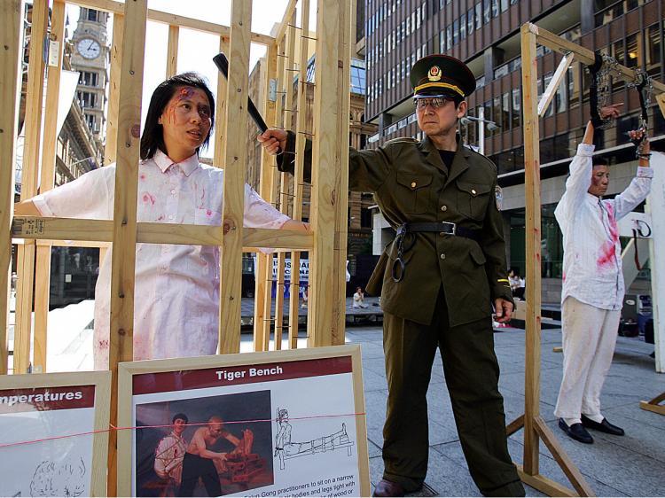 <a><img src="https://www.theepochtimes.com/assets/uploads/2015/09/1totrt52226195.jpg" alt="Falun Gong members re-enact Chinese torture methods used on their practitioners during a demonstration in Sydney. According to the Chinese regime, such torture is completely legal. (Torsten Blackwood/AFP/Getty Images)" title="Falun Gong members re-enact Chinese torture methods used on their practitioners during a demonstration in Sydney. According to the Chinese regime, such torture is completely legal. (Torsten Blackwood/AFP/Getty Images)" width="320" class="size-medium wp-image-1828524"/></a>