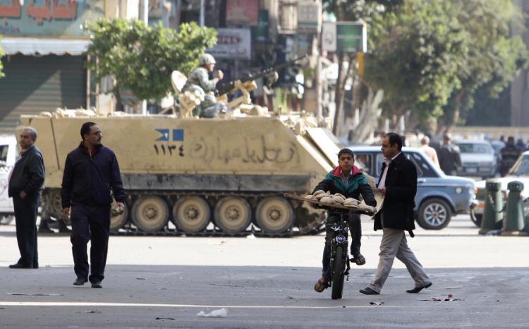 <a><img src="https://www.theepochtimes.com/assets/uploads/2015/09/20110131_108634565_Egypt_2.jpg" alt="BREAD SELLING: An Egyptian boy rides his bicycle near an army tank as he sells bread in central Cairo on Jan. 31. Some Egyptians are trying to carry on with business as usual, but protesters have called for a million people to join a general strike on Tue (Mohammed Abed/AFP/Getty Images)" title="BREAD SELLING: An Egyptian boy rides his bicycle near an army tank as he sells bread in central Cairo on Jan. 31. Some Egyptians are trying to carry on with business as usual, but protesters have called for a million people to join a general strike on Tue (Mohammed Abed/AFP/Getty Images)" width="320" class="size-medium wp-image-1808971"/></a>