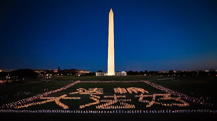 <a><img class="size-full wp-image-1785111" title="In Washington, D.C., Falun Gong practitioners held a candlelight vigil at the Washington Monument, in a large formation spelling out the Chinese characters meaning, "Falun Dafa is good." (Edward Dai/The Epoch Times)" src="https://www.theepochtimes.com/assets/uploads/2015/09/20110715_Edward_J_Dai_20_06_001.jpg" alt="" width="750" height="420"/></a>
