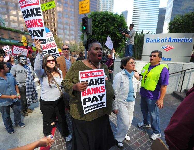 <a><img src="https://www.theepochtimes.com/assets/uploads/2015/09/20111009-128758353-adjusted.jpg" alt="Protesters demonstrate against corporate greed, home foreclosures, and joblessness in downtown Los Angeles on Oct. 6. The Occupy Wall Street protests that began in New York on Sept. 17 are now spreading to other countries, including Canada. (Robyn Beck/AFP/Getty Images)" title="Protesters demonstrate against corporate greed, home foreclosures, and joblessness in downtown Los Angeles on Oct. 6. The Occupy Wall Street protests that began in New York on Sept. 17 are now spreading to other countries, including Canada. (Robyn Beck/AFP/Getty Images)" width="200" class="size-medium wp-image-1796701"/></a>