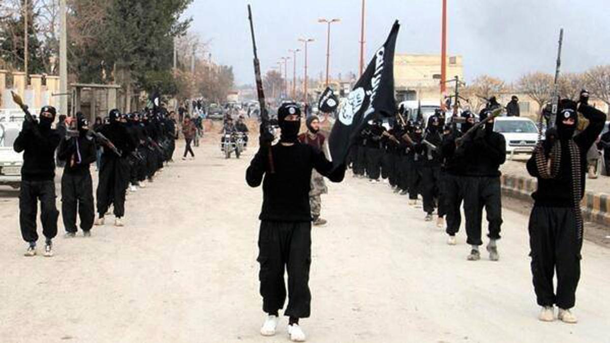  ISIS terrorists parade down a street in Raqqa, Syria, on Jan. 14, 2014. (ISIS Website via AP)