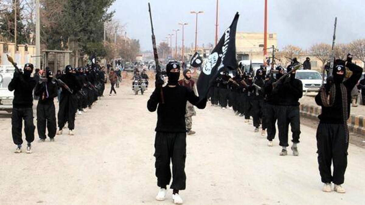 ISIS terrorists parade down a street in Raqqa, Syria, on Jan. 14, 2014. (ISIS Website via AP)