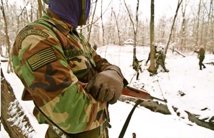<a><img src="https://www.theepochtimes.com/assets/uploads/2015/09/51973255k.jpg" alt="A member of a Michigan militia group watches as fellow survivalists train Dec. 11, 1994 in northern Michigan. Recently members of a militia group calling themselves the 'Hutaree' were arrested over the weekend. (Michael Samojeden/AFP/Getty Images)" title="A member of a Michigan militia group watches as fellow survivalists train Dec. 11, 1994 in northern Michigan. Recently members of a militia group calling themselves the 'Hutaree' were arrested over the weekend. (Michael Samojeden/AFP/Getty Images)" width="320" class="size-medium wp-image-1821607"/></a>