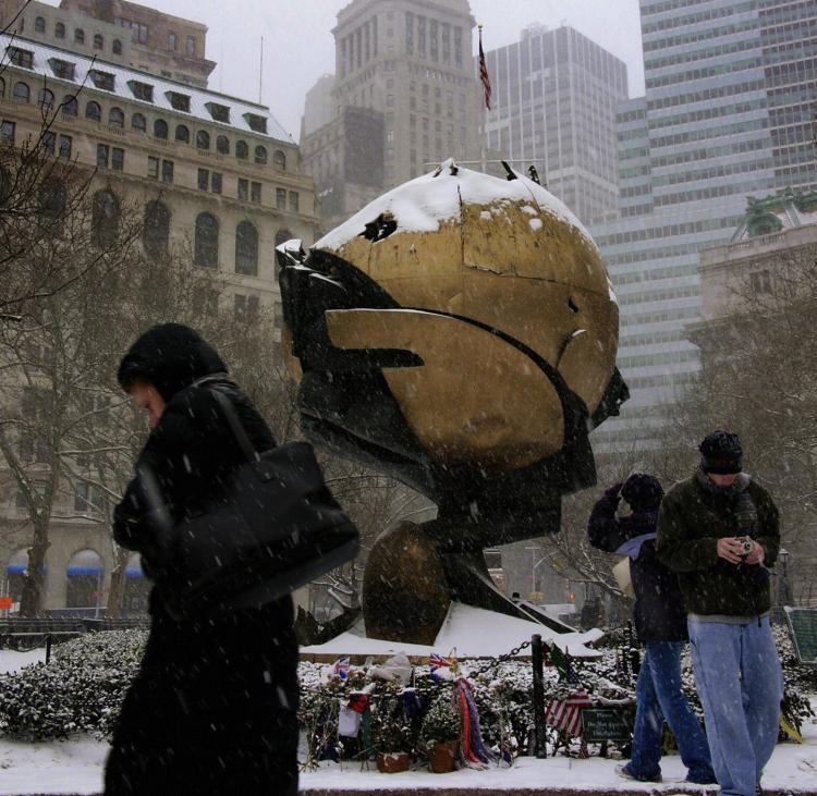 <a><img src="https://www.theepochtimes.com/assets/uploads/2015/09/52048145.jpg" alt="Visitors walk in heavy snow past 'The Sphere,' a sculpture by German architect Fritz Koenig, which survived the fatal terrorist attacks on 9/11 in Battery Park in lower Manhattan, in New York City. (Mandel NGAN/Getty Images)" title="Visitors walk in heavy snow past 'The Sphere,' a sculpture by German architect Fritz Koenig, which survived the fatal terrorist attacks on 9/11 in Battery Park in lower Manhattan, in New York City. (Mandel NGAN/Getty Images)" width="320" class="size-medium wp-image-1807301"/></a>