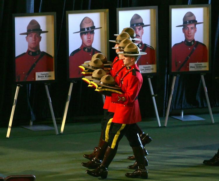 <a><img src="https://www.theepochtimes.com/assets/uploads/2015/09/52372021.jpg" alt="RCMP officers during a memorial service carry the hats of four officers slain in Edmonton in 2005. Two men serving prison sentences for the murders made confessions to Mr. Big operatives.  (Jeff Vinnick/Getty Images)" title="RCMP officers during a memorial service carry the hats of four officers slain in Edmonton in 2005. Two men serving prison sentences for the murders made confessions to Mr. Big operatives.  (Jeff Vinnick/Getty Images)" width="320" class="size-medium wp-image-1825268"/></a>