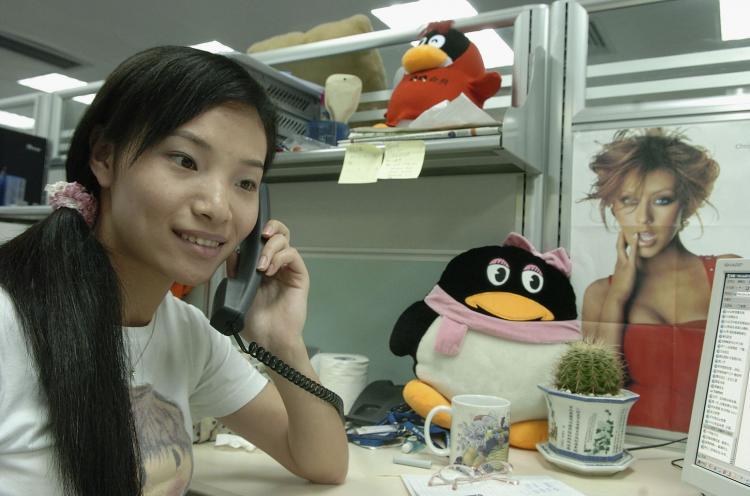 <a><img src="https://www.theepochtimes.com/assets/uploads/2015/09/55936731QQ.jpg" alt="A worker makes a phone call beside an emblem of Tencent QQ instant messaging service, in the headquarters office of the Tencent Holdings Limited in Shenzhen, Guangdong Province, China. The QQ monopoly is suspected of being backed by the communist regime. (China Photos/Getty Images)" title="A worker makes a phone call beside an emblem of Tencent QQ instant messaging service, in the headquarters office of the Tencent Holdings Limited in Shenzhen, Guangdong Province, China. The QQ monopoly is suspected of being backed by the communist regime. (China Photos/Getty Images)" width="320" class="size-medium wp-image-1812448"/></a>