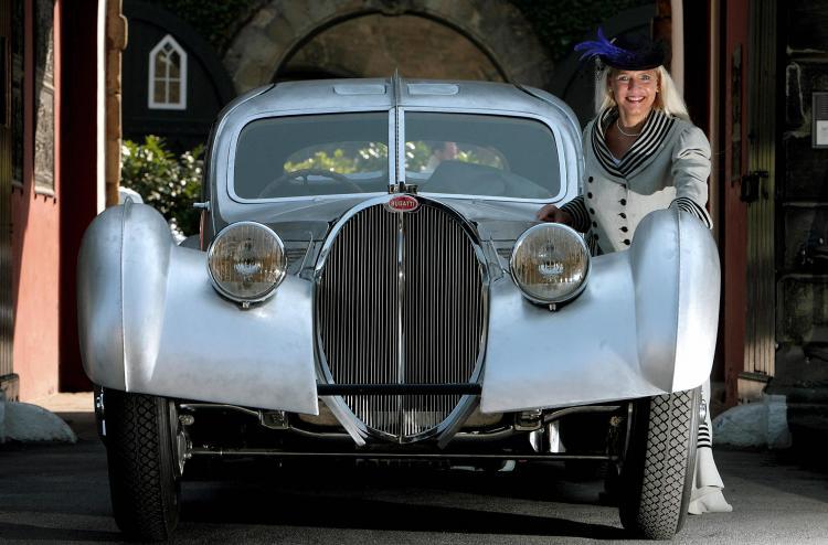 <a><img src="https://www.theepochtimes.com/assets/uploads/2015/09/73717295.jpg" alt="Fair hostesses Sandra poses beside a Bugatti Type 57SC Atlantic car constructed in 1937 to promote the Techno Classica fair, 27 March 2007 in Essen, western Germany. (Volker Hartmann/Getty Images)" title="Fair hostesses Sandra poses beside a Bugatti Type 57SC Atlantic car constructed in 1937 to promote the Techno Classica fair, 27 March 2007 in Essen, western Germany. (Volker Hartmann/Getty Images)" width="320" class="size-medium wp-image-1820230"/></a>