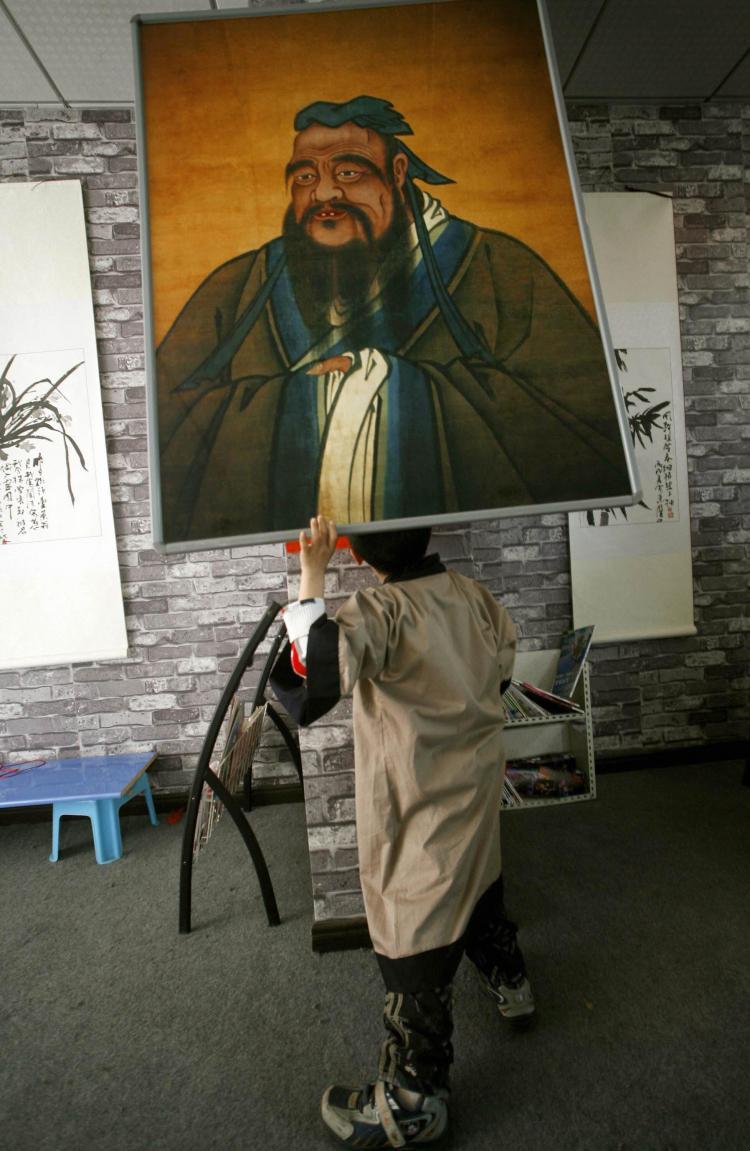 <a><img src="https://www.theepochtimes.com/assets/uploads/2015/09/73944652.jpg" alt="A Chinese boy looks at an image of Confucius, the ancient Chinese philosopher. (Liu Jin/AFP/Getty Images)" title="A Chinese boy looks at an image of Confucius, the ancient Chinese philosopher. (Liu Jin/AFP/Getty Images)" width="320" class="size-medium wp-image-1834783"/></a>