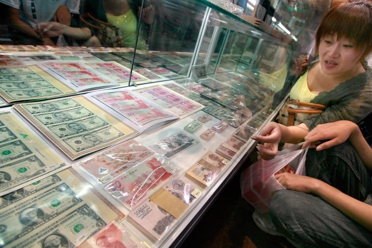 <a><img src="https://www.theepochtimes.com/assets/uploads/2015/09/76063218forex.jpg" alt="U.S. dollar bills and Chinese yuan notes at a currency souvenir shop in Beijing. China has huge forex reserves that are causing concern in the U.S.  (Teh Eng Koon/AFP/Getty Images)" title="U.S. dollar bills and Chinese yuan notes at a currency souvenir shop in Beijing. China has huge forex reserves that are causing concern in the U.S.  (Teh Eng Koon/AFP/Getty Images)" width="320" class="size-medium wp-image-1834563"/></a>