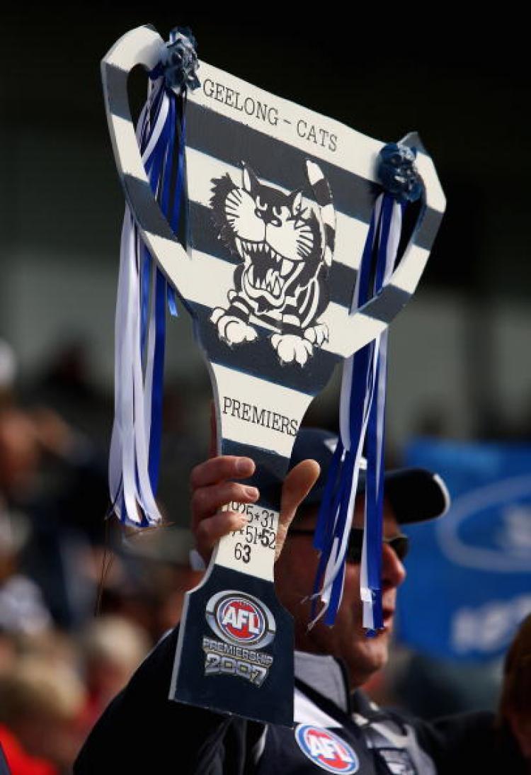 <a><img src="https://www.theepochtimes.com/assets/uploads/2015/09/77053254.jpg" alt="A Geelong Cats supporter holds up a cardboard replica of the AFL Premiership Cup. Is 2008 on the cards? (Mark Dadswell/Getty Images)" title="A Geelong Cats supporter holds up a cardboard replica of the AFL Premiership Cup. Is 2008 on the cards? (Mark Dadswell/Getty Images)" width="320" class="size-medium wp-image-1834675"/></a>