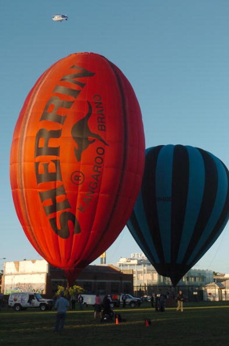 <a><img src="https://www.theepochtimes.com/assets/uploads/2015/09/79460833.jpg" alt="A giant Australian Rules Football-shaped ballon is lit up by the rising sun during celebrations marking the 150th anniversary of the first Australian balloon flight in Melbourne. (Paul Crock/AFP/Getty Images)" title="A giant Australian Rules Football-shaped ballon is lit up by the rising sun during celebrations marking the 150th anniversary of the first Australian balloon flight in Melbourne. (Paul Crock/AFP/Getty Images)" width="320" class="size-medium wp-image-1834513"/></a>
