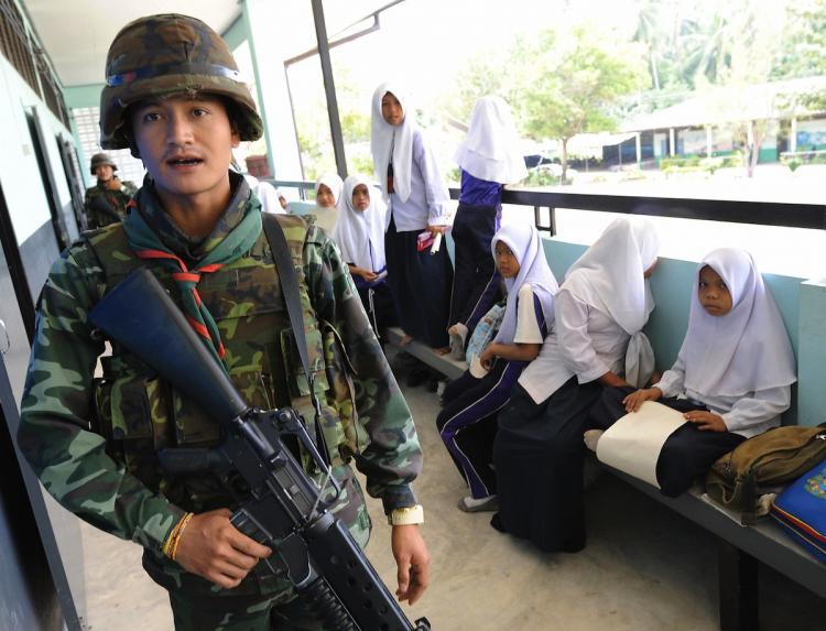 <a><img src="https://www.theepochtimes.com/assets/uploads/2015/09/80327914.jpg" alt="SOLDIERS OCCUPYING SCHOOLS: Thai soldiers walk past Muslim students while checking security at a classroom in Pattani Province, southern Thailand. Fourteen government teachers have been killed this year by suspected Muslim insurgents.  (Pornchai Kittiwongsakul/Getty Images )" title="SOLDIERS OCCUPYING SCHOOLS: Thai soldiers walk past Muslim students while checking security at a classroom in Pattani Province, southern Thailand. Fourteen government teachers have been killed this year by suspected Muslim insurgents.  (Pornchai Kittiwongsakul/Getty Images )" width="320" class="size-medium wp-image-1814402"/></a>