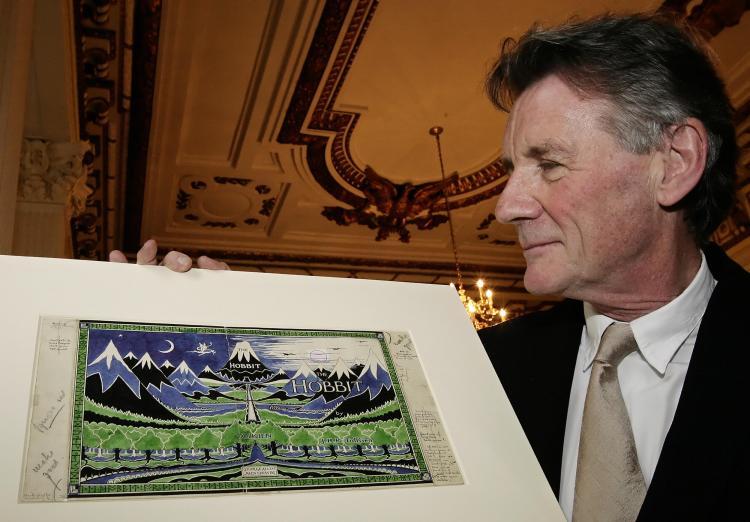 <a><img src="https://www.theepochtimes.com/assets/uploads/2015/09/81253642.jpg" alt="JRR Tolkien: Michael Palin holds an original artwork of JRR Tolkien's 'The Hobbit' at the launch of the 'Oxford Thinking' campaign in London on May 28, 2008. (Leon Neal/AFP/Getty Images)" title="JRR Tolkien: Michael Palin holds an original artwork of JRR Tolkien's 'The Hobbit' at the launch of the 'Oxford Thinking' campaign in London on May 28, 2008. (Leon Neal/AFP/Getty Images)" width="320" class="size-medium wp-image-1810183"/></a>