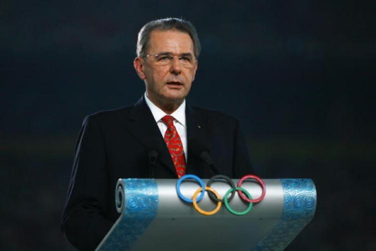 <a><img src="https://www.theepochtimes.com/assets/uploads/2015/09/82219362.jpg" alt="Jacques Rogge, President of the International Olympic Committee (IOC) speaks during the Opening Ceremony. (Paul Gilham/Getty Images)" title="Jacques Rogge, President of the International Olympic Committee (IOC) speaks during the Opening Ceremony. (Paul Gilham/Getty Images)" width="320" class="size-medium wp-image-1834382"/></a>