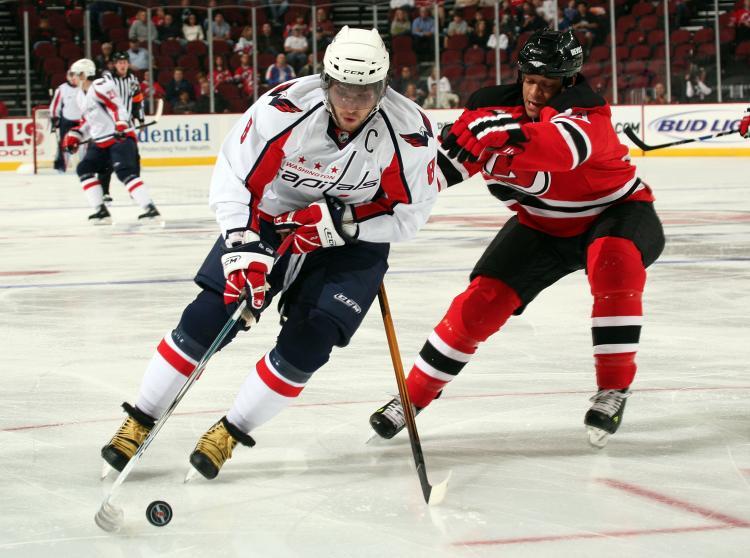 <a><img src="https://www.theepochtimes.com/assets/uploads/2015/09/83055728.jpg" alt="UNSTOPPABLE: Alex Ovechkin of the Washington Capitals (left) rushes around Bryce Salvador of the New Jersey Devils in preseason NHL action. ( Bruce Bennett/Getty Images)" title="UNSTOPPABLE: Alex Ovechkin of the Washington Capitals (left) rushes around Bryce Salvador of the New Jersey Devils in preseason NHL action. ( Bruce Bennett/Getty Images)" width="320" class="size-medium wp-image-1833425"/></a>
