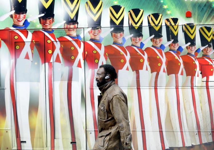 <a><img src="https://www.theepochtimes.com/assets/uploads/2015/09/84083837.jpg" alt="A man walks by a painted advertisement on a side of a bus for Broadway production of the Radio City Christmas Spectacular show, in New York. (Emmanuel Dunand/AFP/Getty Images)" title="A man walks by a painted advertisement on a side of a bus for Broadway production of the Radio City Christmas Spectacular show, in New York. (Emmanuel Dunand/AFP/Getty Images)" width="320" class="size-medium wp-image-1832272"/></a>