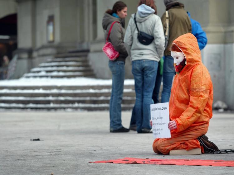 <a><img src="https://www.theepochtimes.com/assets/uploads/2015/09/84236322.jpg" alt="An activist of Amnesty International dressed as a Guantanamo bay prisoner protests on January 10, 2009 in Berne. (MicheleI Limina/AFP/Getty Images)" title="An activist of Amnesty International dressed as a Guantanamo bay prisoner protests on January 10, 2009 in Berne. (MicheleI Limina/AFP/Getty Images)" width="320" class="size-medium wp-image-1815279"/></a>