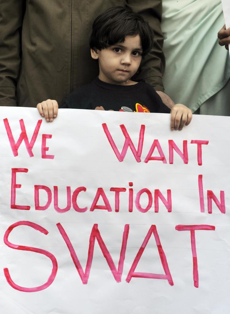 <a><img src="https://www.theepochtimes.com/assets/uploads/2015/09/84510034_swat.jpg" alt="SOLIDARITY WITH GIRLS: A young girl in Karachi poses with a placard during a protest organized by a student organization representing students from Pakistan's Northwest Frontier Province on Jan. 28. She and others came out to condemn the recent attacks on girls' schools in Swat Valley. (Asif Hassan/AFP/Getty Images)" title="SOLIDARITY WITH GIRLS: A young girl in Karachi poses with a placard during a protest organized by a student organization representing students from Pakistan's Northwest Frontier Province on Jan. 28. She and others came out to condemn the recent attacks on girls' schools in Swat Valley. (Asif Hassan/AFP/Getty Images)" width="320" class="size-medium wp-image-1830829"/></a>