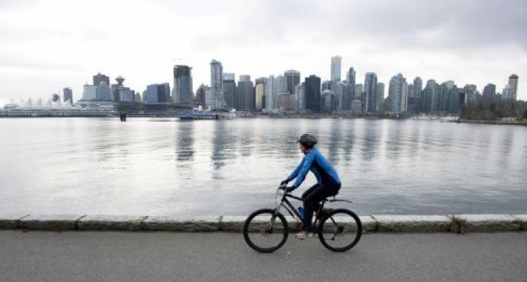 <a><img src="https://www.theepochtimes.com/assets/uploads/2015/09/84684366.jpg" alt="A cyclist rides in front of the skyline of Vancouver February 7, 2009 in Vancouver, British Columbia.  (Don Emmert/AFP/Getty Images)" title="A cyclist rides in front of the skyline of Vancouver February 7, 2009 in Vancouver, British Columbia.  (Don Emmert/AFP/Getty Images)" width="320" class="size-medium wp-image-1829966"/></a>