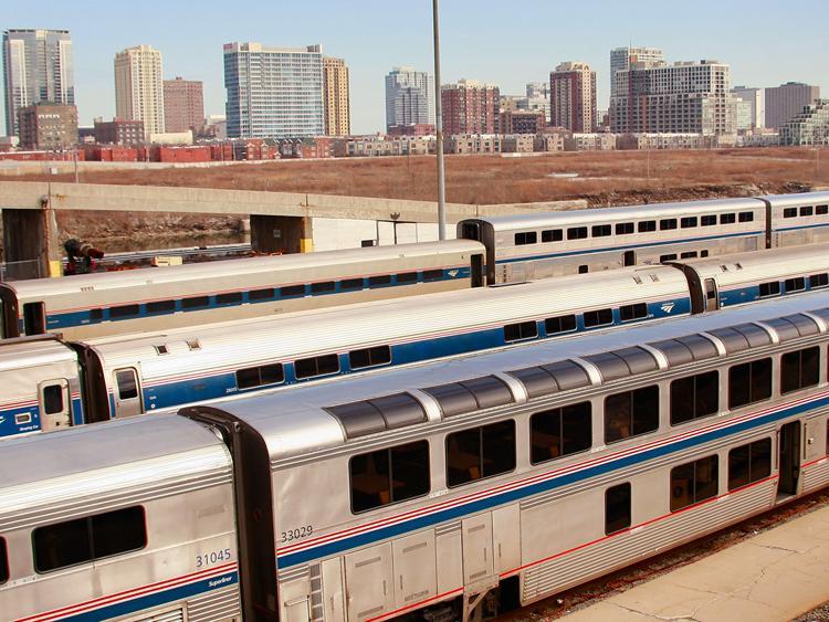 <a><img src="https://www.theepochtimes.com/assets/uploads/2015/09/85419166.jpg" alt="NEED SPEED UPGRADE: Amtrak cars sit in a rail yard on the southern edge of downtown Chicago, Illinois. Gov. Pat Quinn announced further construction of a high-speed rail line linking Chicago and St. Louis. (Scott Olson/Getty Images)" title="NEED SPEED UPGRADE: Amtrak cars sit in a rail yard on the southern edge of downtown Chicago, Illinois. Gov. Pat Quinn announced further construction of a high-speed rail line linking Chicago and St. Louis. (Scott Olson/Getty Images)" width="320" class="size-medium wp-image-1806245"/></a>