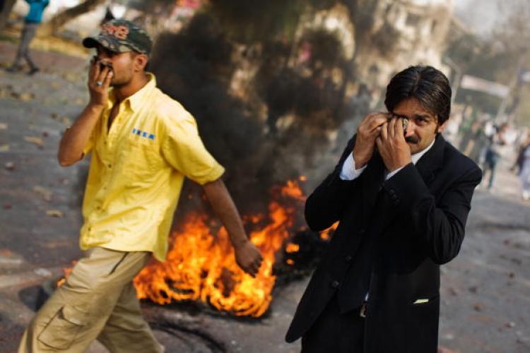 <a><img src="https://www.theepochtimes.com/assets/uploads/2015/09/85434119.jpg" alt="A CLASH: A lawyer wipes tears from his eyes after being affected by tear gas during clashes with police on March 15 in Lahore, Pakistan. (Daniel Berehulak/Getty Images)" title="A CLASH: A lawyer wipes tears from his eyes after being affected by tear gas during clashes with police on March 15 in Lahore, Pakistan. (Daniel Berehulak/Getty Images)" width="320" class="size-medium wp-image-1829608"/></a>