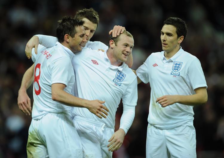 <a><img src="https://www.theepochtimes.com/assets/uploads/2015/09/85678445.jpg" alt="ROAD TO WORLD CUP: Wayne Rooney celebrates with his team mates after he scored during the International Friendly match between England and Slovakia at Wembley Stadium on March 28 (Shaun Botterill/Getty Images)" title="ROAD TO WORLD CUP: Wayne Rooney celebrates with his team mates after he scored during the International Friendly match between England and Slovakia at Wembley Stadium on March 28 (Shaun Botterill/Getty Images)" width="320" class="size-medium wp-image-1820169"/></a>