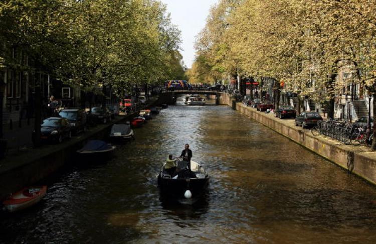 <a><img src="https://www.theepochtimes.com/assets/uploads/2015/09/87216101.jpg" alt="The mayor estimated that for 1 million out of the 4 million tourists who visit Amsterdam each year, coffee shops are a reason for their visit. (Mark Dadswell/Getty Images)" title="The mayor estimated that for 1 million out of the 4 million tourists who visit Amsterdam each year, coffee shops are a reason for their visit. (Mark Dadswell/Getty Images)" width="320" class="size-medium wp-image-1810069"/></a>