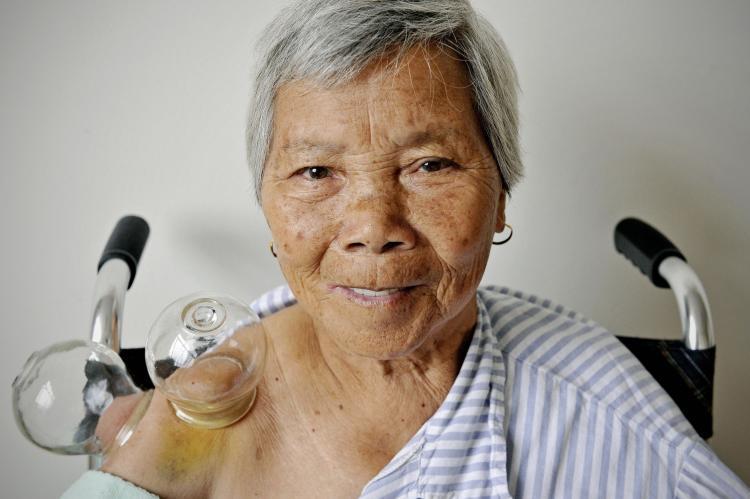 <a><img src="https://www.theepochtimes.com/assets/uploads/2015/09/91108550cupping.jpg" alt="An elderly woman looks on as her skin bruises on her shoulder during treatment with a traditional Chinese medical technique known as 'cupping' at a community health center in Shanghai on September 24, 2009.  (Philippe Lopez/AFP/Getty Images)" title="An elderly woman looks on as her skin bruises on her shoulder during treatment with a traditional Chinese medical technique known as 'cupping' at a community health center in Shanghai on September 24, 2009.  (Philippe Lopez/AFP/Getty Images)" width="320" class="size-medium wp-image-1804272"/></a>