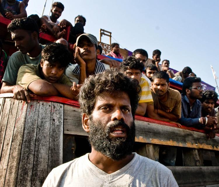 <a><img src="https://www.theepochtimes.com/assets/uploads/2015/09/91936349-WEB.jpg" alt="Sri Lankan asylum seekers after their boat broke down in Indonesia. They were on the way to Australia's Christmas Island. (Oscar Siagian/Getty Images)" title="Sri Lankan asylum seekers after their boat broke down in Indonesia. They were on the way to Australia's Christmas Island. (Oscar Siagian/Getty Images)" width="320" class="size-medium wp-image-1815221"/></a>