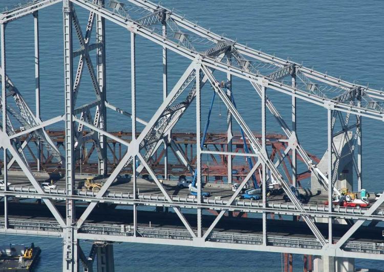 <a><img src="https://www.theepochtimes.com/assets/uploads/2015/09/92555637_web.jpg" alt="Workers continue to make emergency repairs to the eastern span of the San Francisco Bay Bridge. Repair work on the collapsed section will continue through the weekend. (Justin Sullivan/Getty Images)" title="Workers continue to make emergency repairs to the eastern span of the San Francisco Bay Bridge. Repair work on the collapsed section will continue through the weekend. (Justin Sullivan/Getty Images)" width="320" class="size-medium wp-image-1825492"/></a>