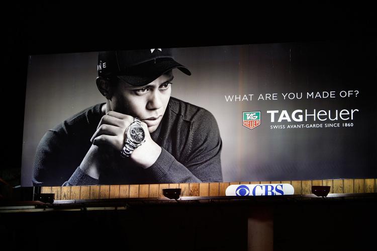 <a><img src="https://www.theepochtimes.com/assets/uploads/2015/09/94294247.jpg" alt="A TAG Heuer watch billboard with an image of Tiger Woods is shown on Dec. 11 in Los Angeles, California. Woods announced that he will take an indefinite break from professional golf to concentrate on repairing family relations after admitting to infidelit (David McNew/Getty Images)" title="A TAG Heuer watch billboard with an image of Tiger Woods is shown on Dec. 11 in Los Angeles, California. Woods announced that he will take an indefinite break from professional golf to concentrate on repairing family relations after admitting to infidelit (David McNew/Getty Images)" width="320" class="size-medium wp-image-1824748"/></a>